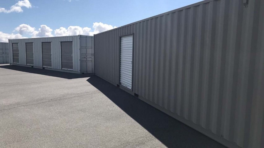 storage container with roll up door grey color blue sky cloud shipping containers with roll up doors man doors modified container