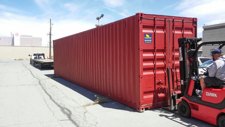 red color shipping container red storage container blue sky cloudy forklift red color forklift