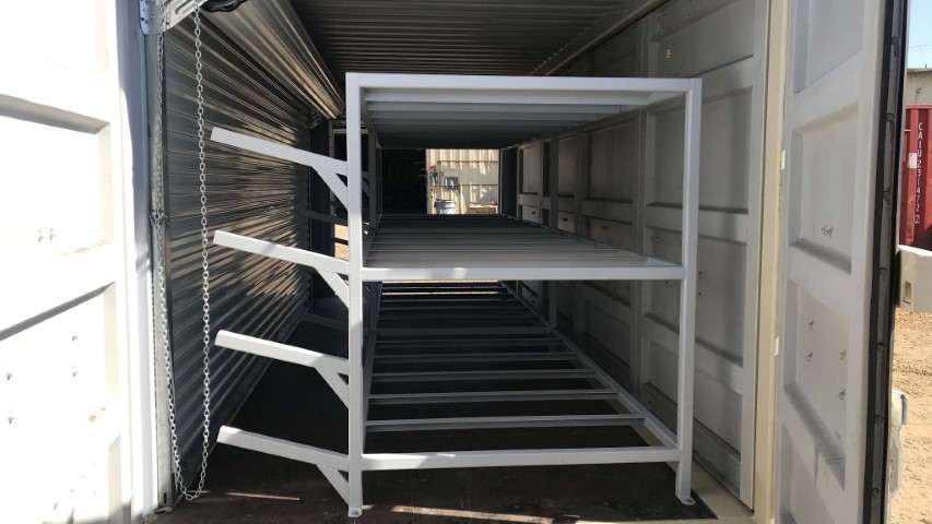 shelving unit inside shipping container and storage container cargo doors opened