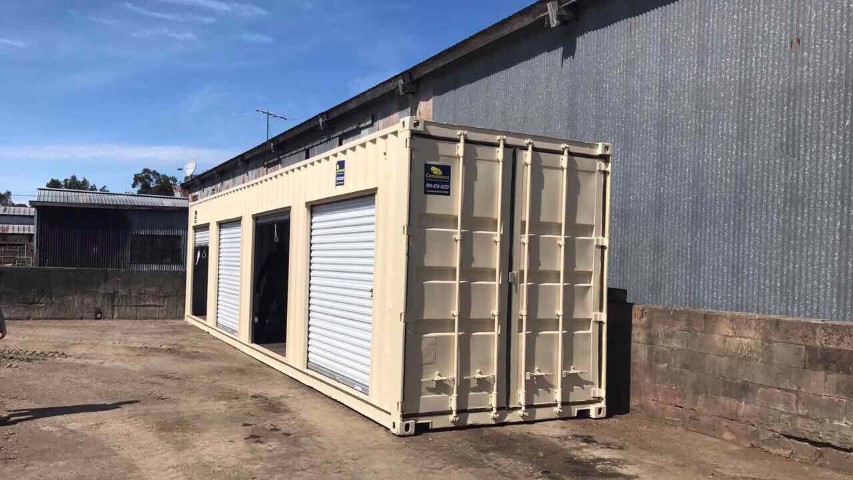 shipping container roll up door storage container roll up door blue skies factory facility cream color storage container 