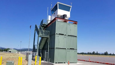 Truckee container tower airport blue sky conexwest green storage container