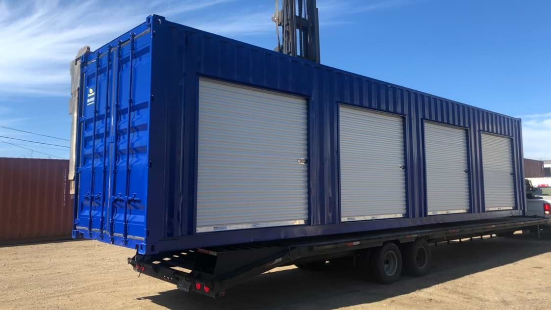 Blue storage container with roll up doors