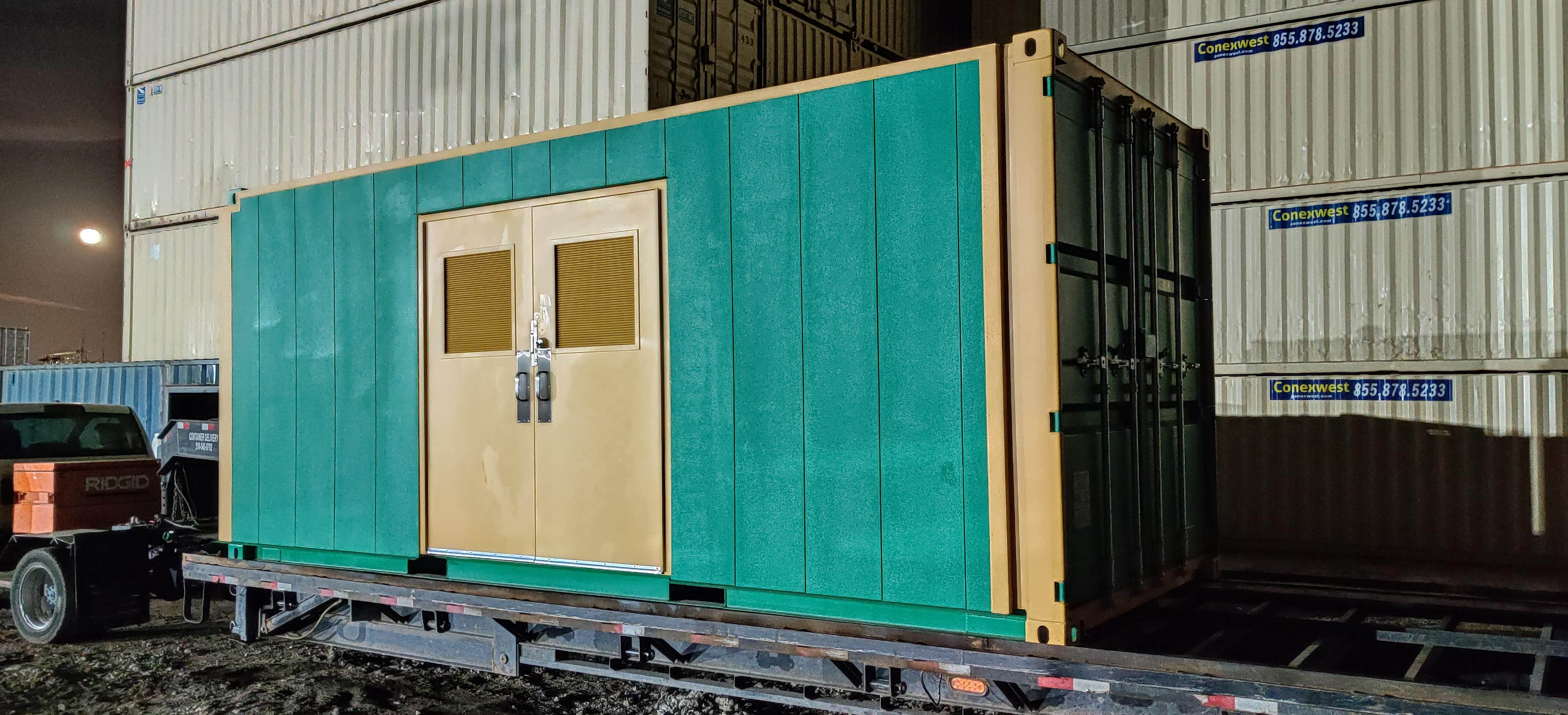 green shipping storage container with door