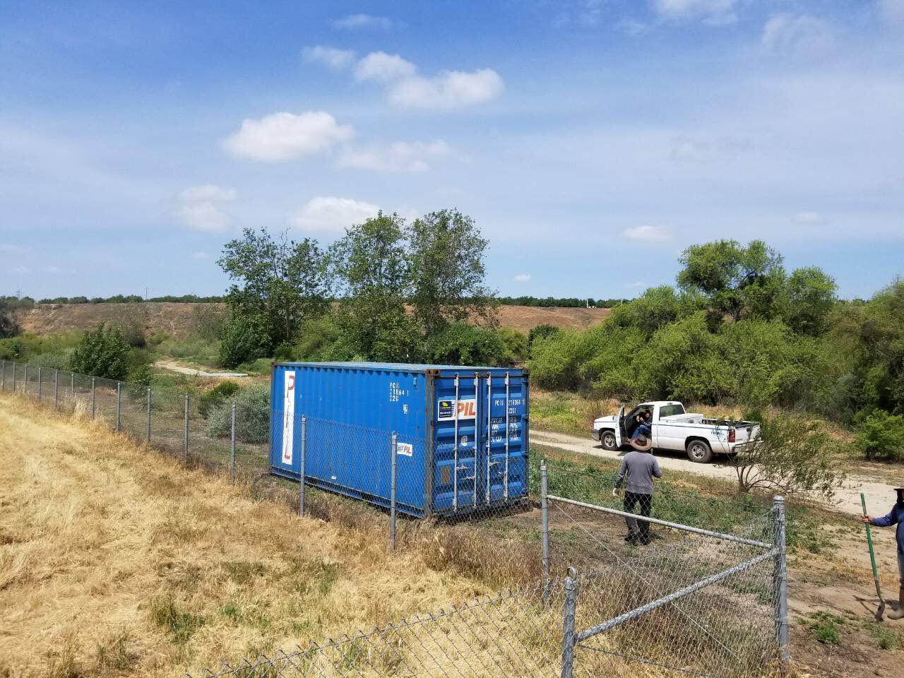 Used shipping container on a filed 