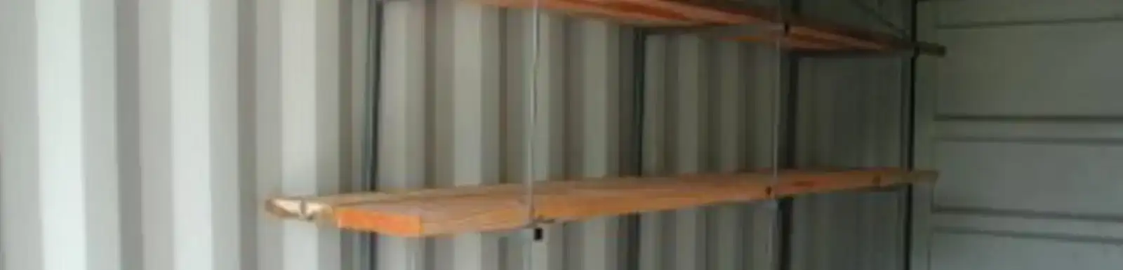 Removable shelving system for shipping containers for rent